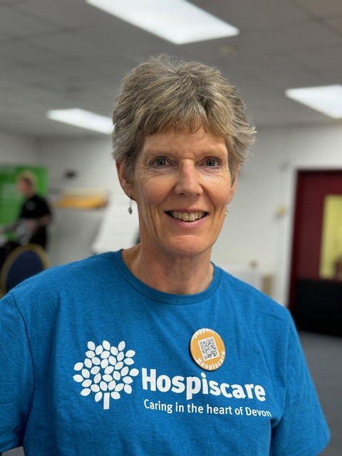 A woman wearing a Hospiscare t-shirt