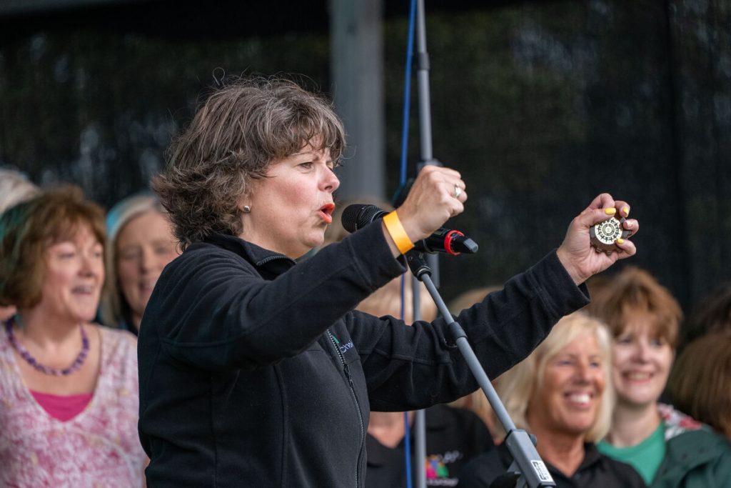 A woman on stage singing