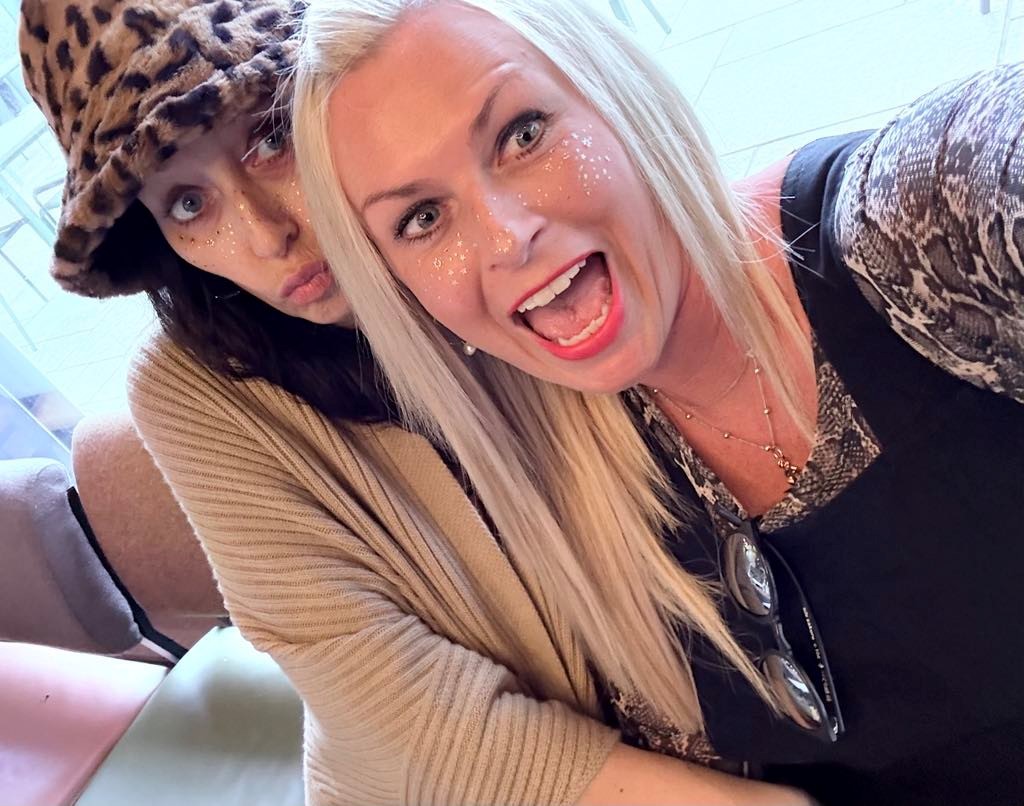 Two women taking a selfie at a party